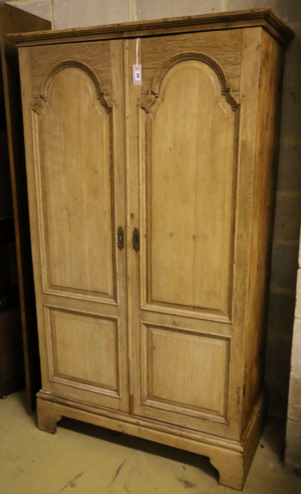 A Georgian style oak two door wardrobe, width 102cm depth 52cm height 179cm